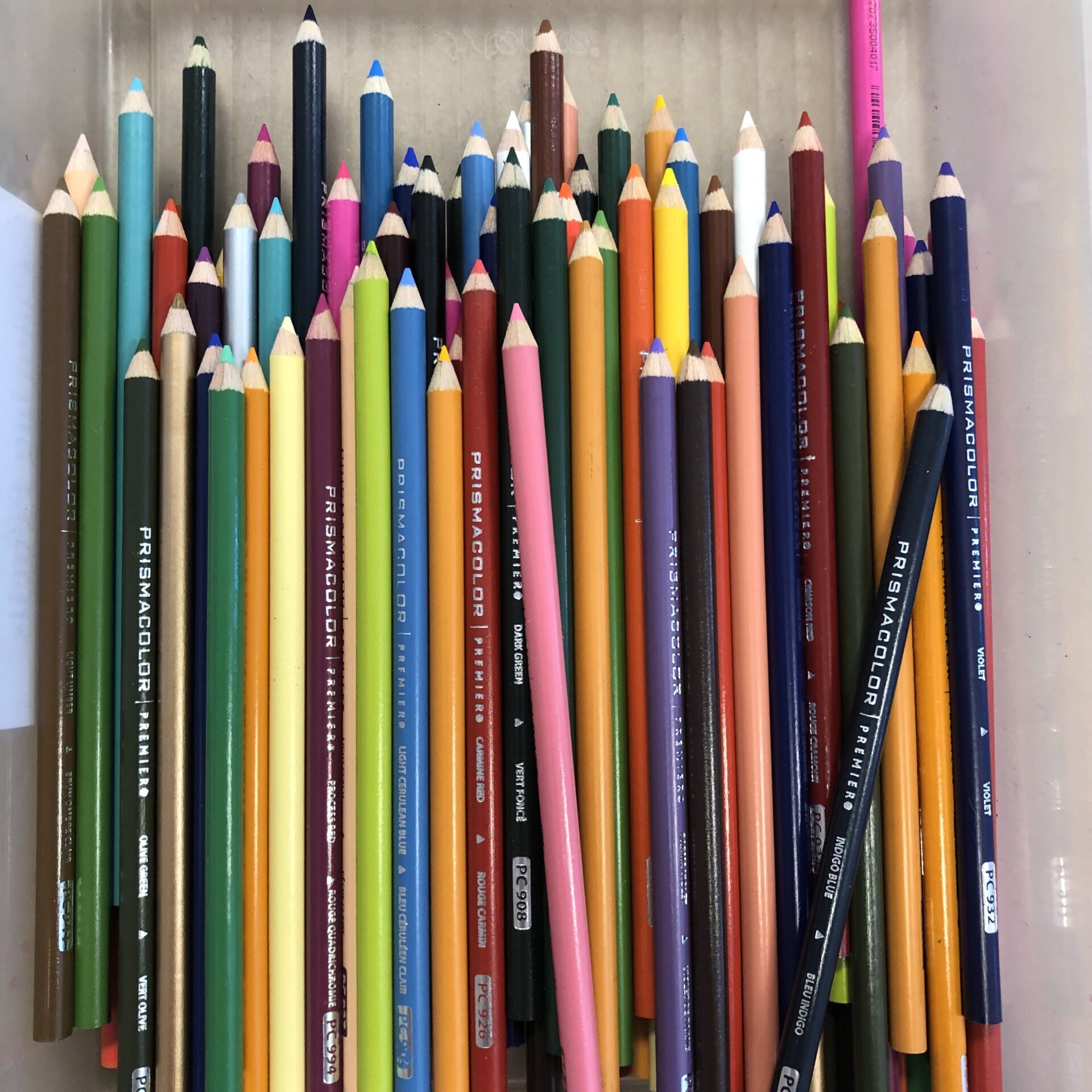Newly sharpened colored pencils in all different colors in vertical orientation