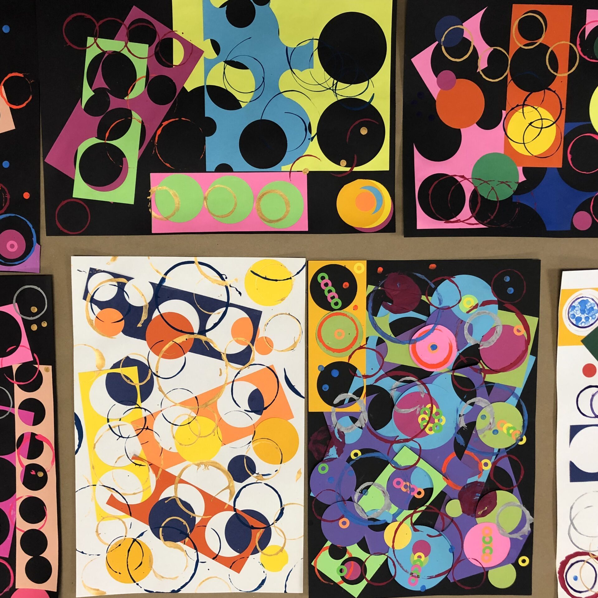 Collage and paint artworks featuring circular shapes.