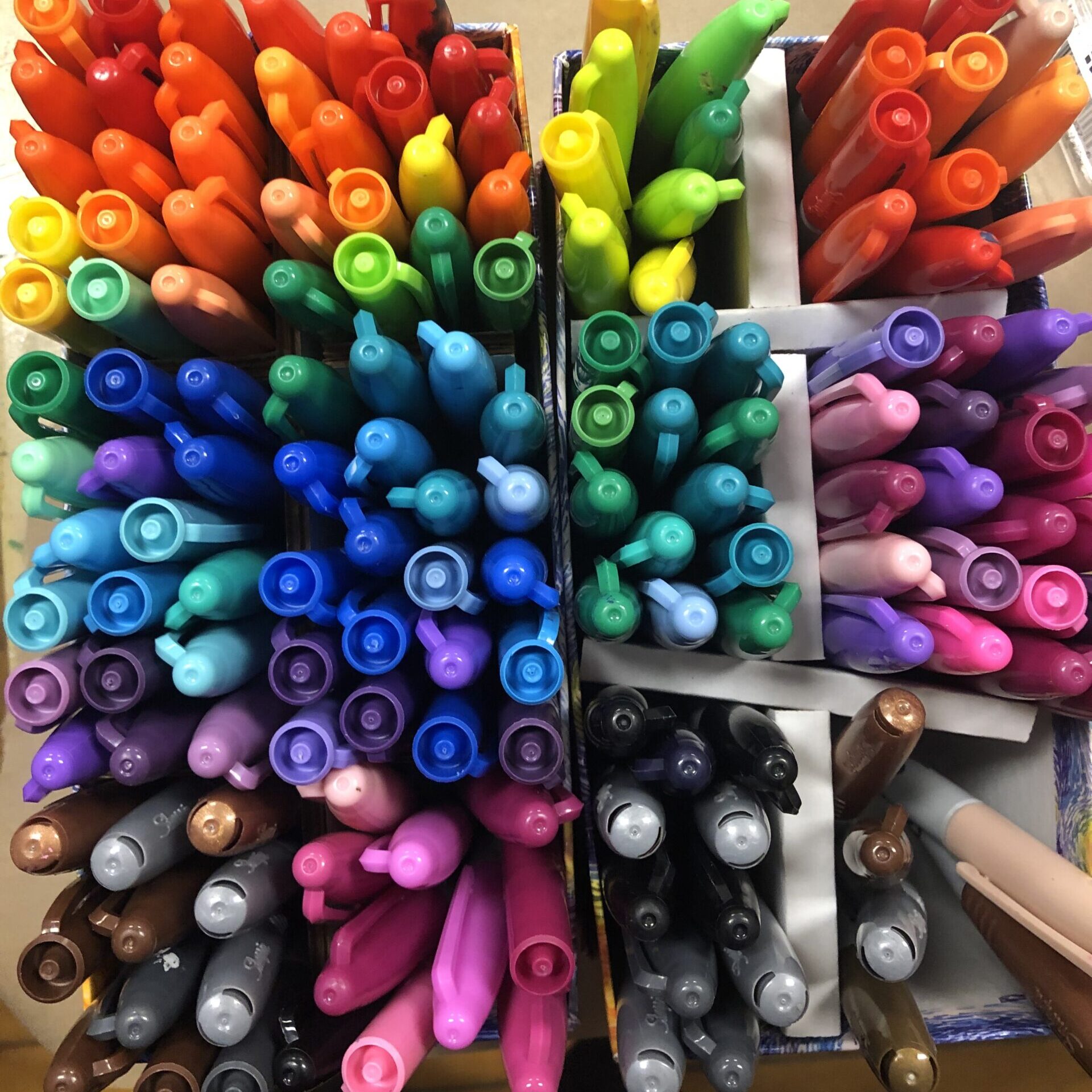 Overhead of colorful sharpie markers.