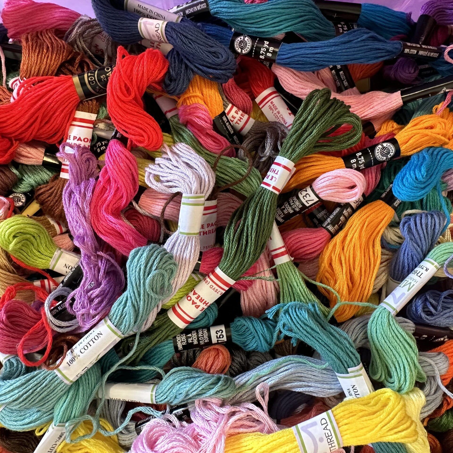 Pile of colorful skeins of embroidery floss. 