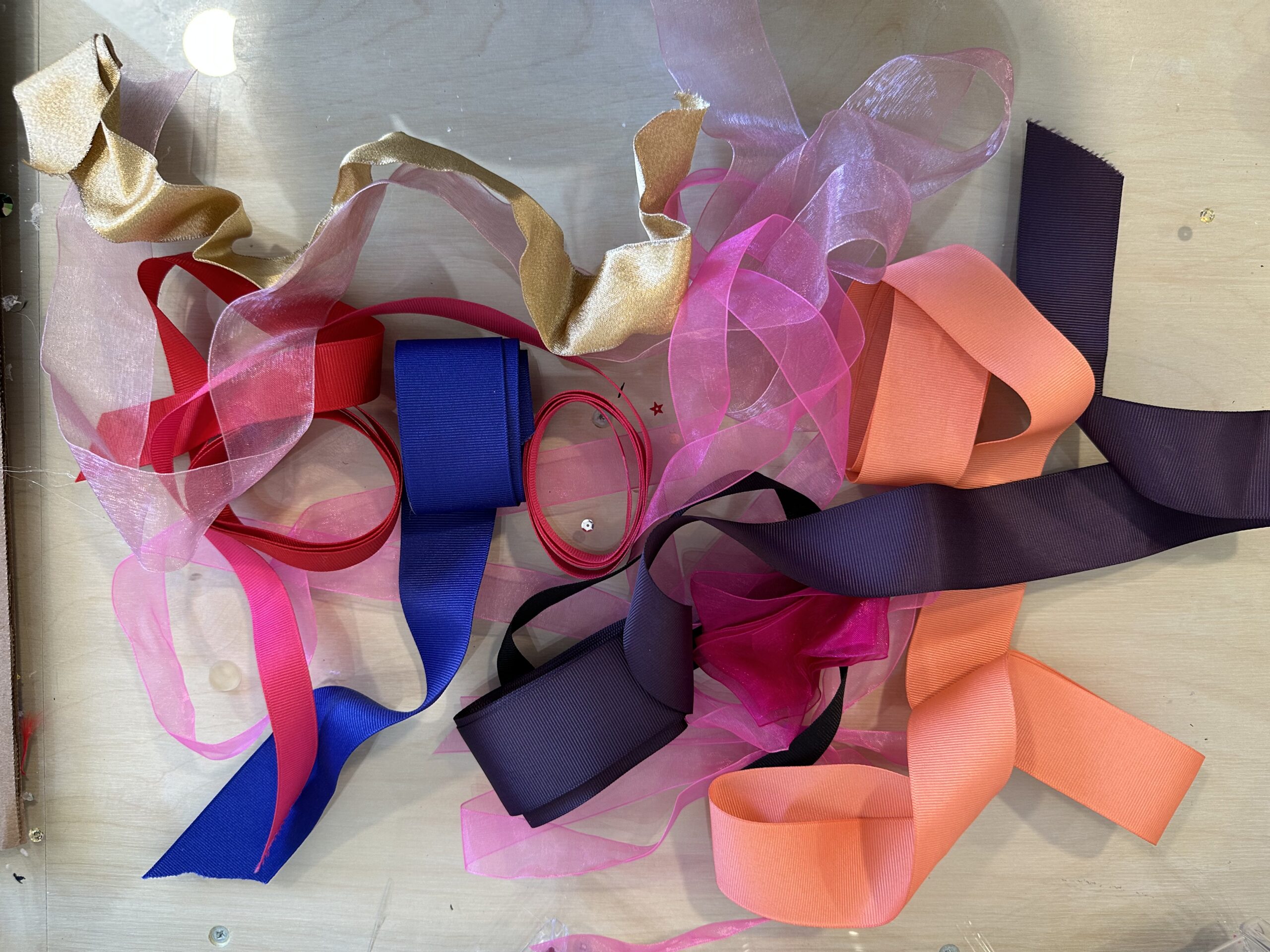 Random pile of different color and material ribbons