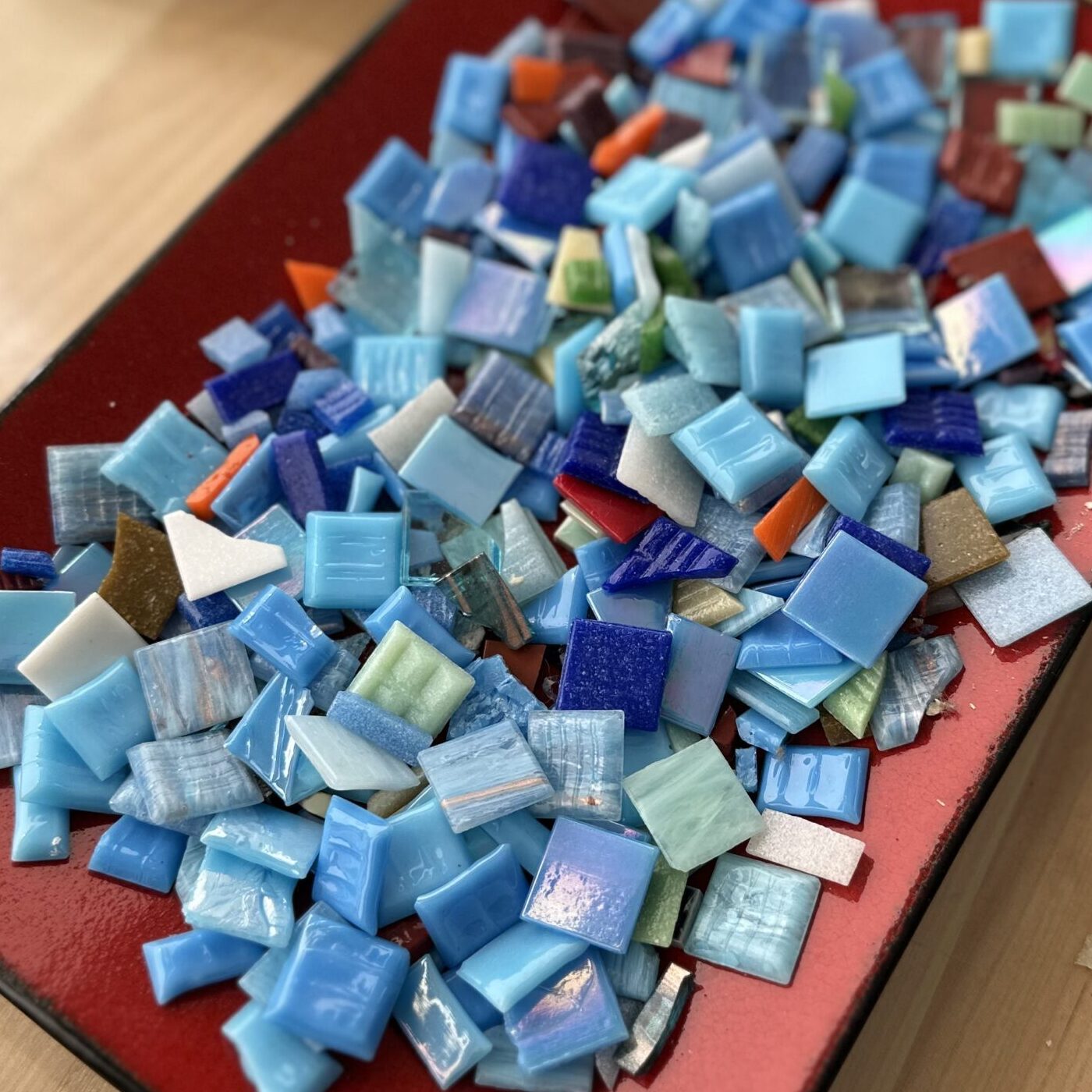 Collection of different shades of blue glass tiles for mosaic.
